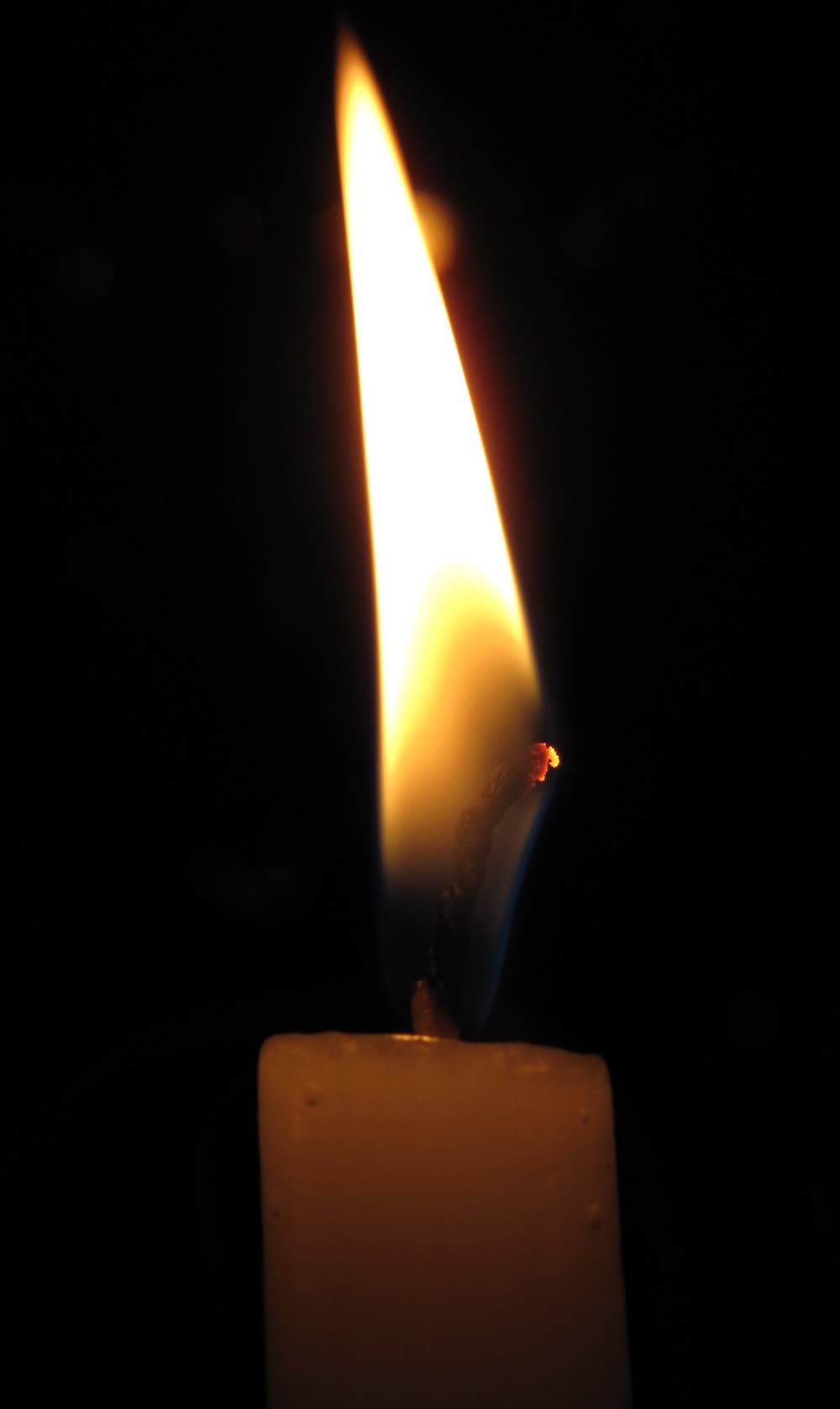 Candle flame against a dark background