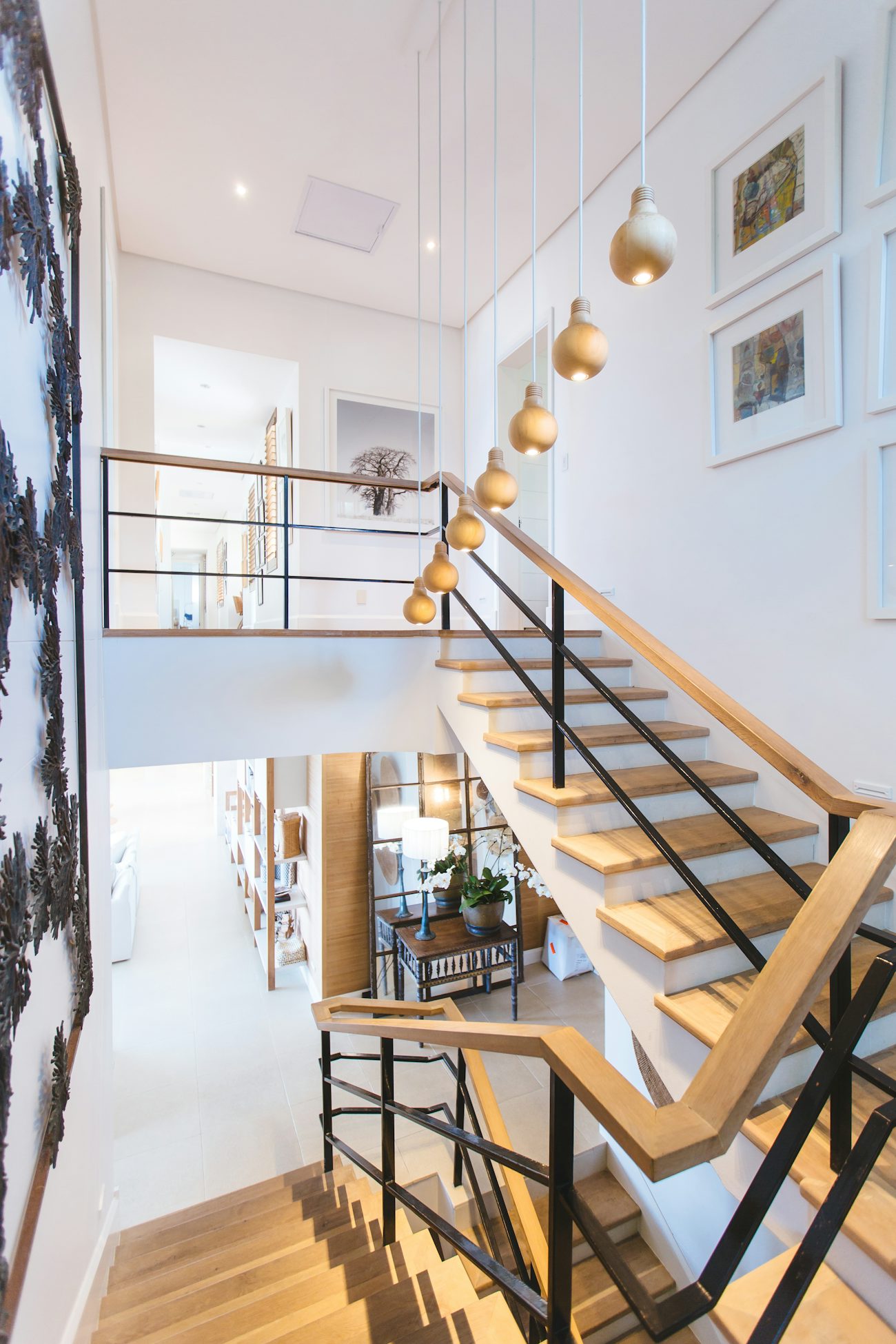 Bright modern duplex interior with a floating staircase